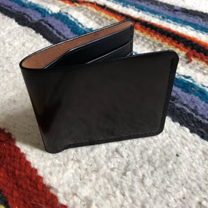 Black vegetable dyed bi fold wallet